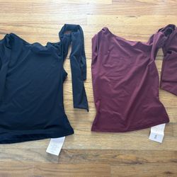 Black and burgundy tank Tops with tie embellishment on sleeve. Size extra small, both new with tags 