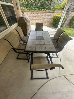 Outdoor dining table with 6 Chairs and fire pit