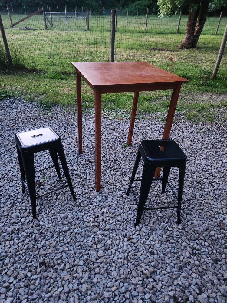 Tall Table With Two Metal Chairs/Stools