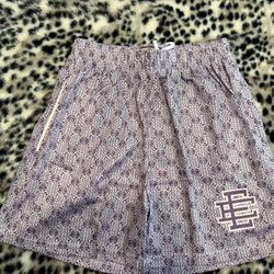 Purple Gucci EE shorts with purple Gucci logo, size medium