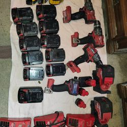 Milwaukee Power Tools, 3 Drills , 1 impact, 2 Lazer levels, 11 Milwaukee m18 batteries, 3 m12 batteries, 3 DeWalt batteries, 3 Milwaukee dual chargers