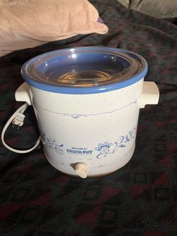 Adjustable heat slow cooker