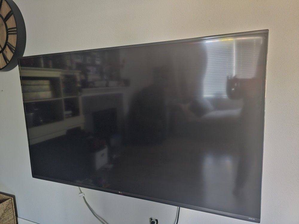 70" LG Ultra HD TV with Wall Mount and 2 LG remotes