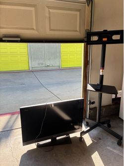 Rolling tv stand with tv