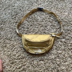 The North Face Yellow Hiking Waist Pack with Zip Closure and 2 Pockets