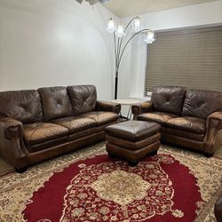 Brown Leather Couch 3 seater and love seat w/ ottoman, lounge chair, & chandelier 
