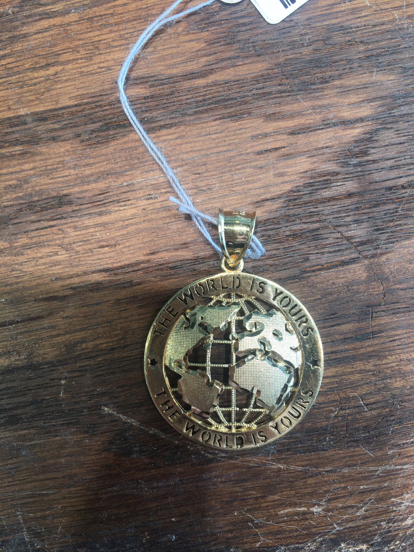 The World Is Yours Gold Pendant