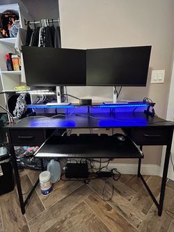 Gaming desk with LED light and power outlet