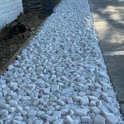 White landscaping rocks 1" to 2", 50 pound bags.