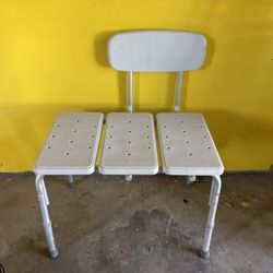 Height-adjustable shower transfer bench