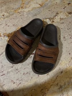 Brown crocs slides