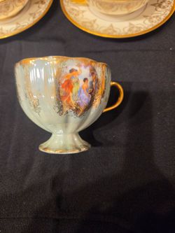 Vintage Porcelain Footed Teacup with Figural Scene