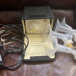Breast Pump And Lots Of Bottles