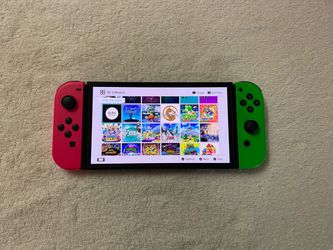Nintendo Switch OLED with 125 Popular Switch Games