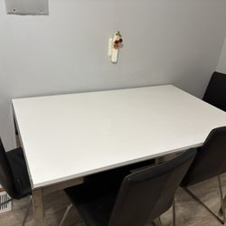 IKEA High Gloss White Dining Table And Black Chairs