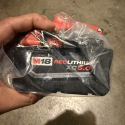 Milwaukee m18 multi tool with 5.0 battery and m18/m12 battery charger