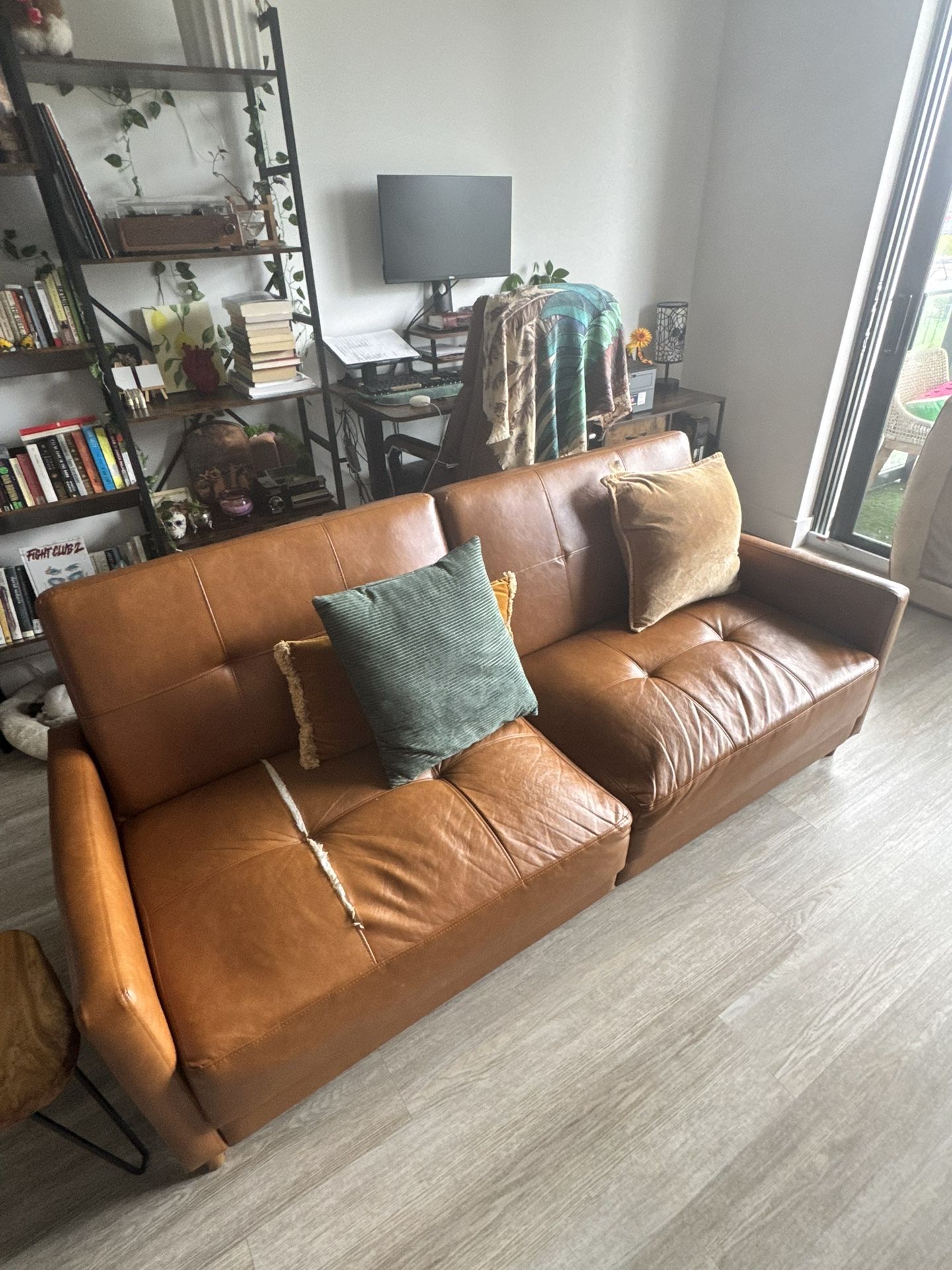 Tan Pleather sofa.