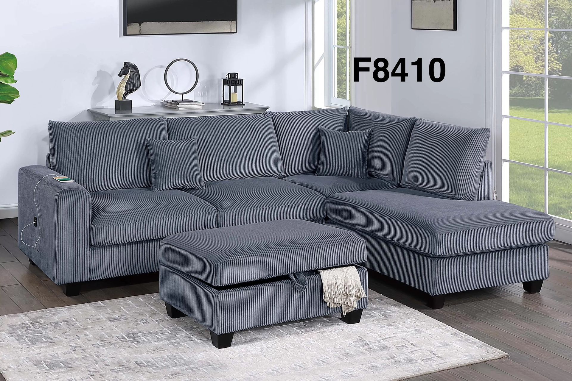 GREY SECTIONAL WITH RIGHT SIDED CHAISE. STORAGE OTTOMAN INCLUDED 