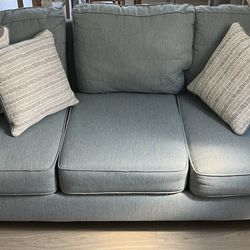 Blue Couch With Four Pillows