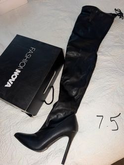 Black heeled leather boots size 7.5