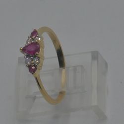 14kt yellow gold ring 1.5 grams 4 diamonds 0.15 pts & 3 rubies size 6.5 mint condition. 878316-1.