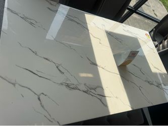 Marble dinning room table with 4 chairs and a bench