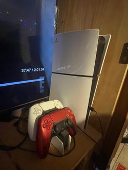 PS5 Slim with charging Dock.and 2 controller s