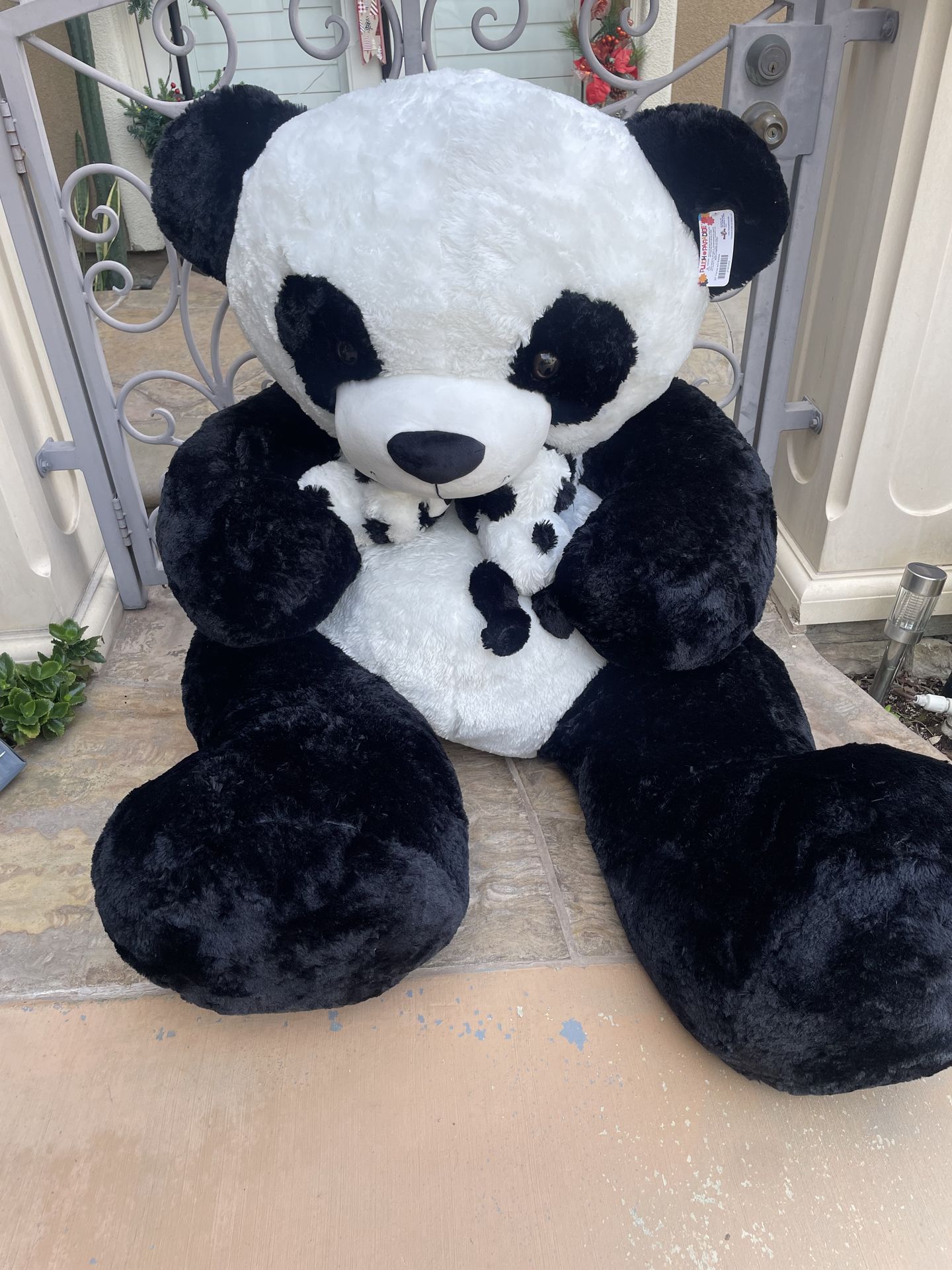 Huge panda bear with babies