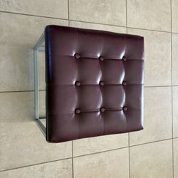 Two Faux Leather Wine-colored Footstools/ottomans