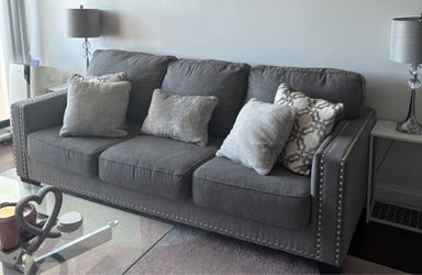 Grey Couch with side tables and lamps