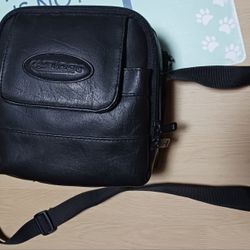 CASELOGIC BLACK LEATHER CAMERA CASE W/3 STORAGE COMPARTMENTS, STRAP & BAG OF EXTRA STRAPS & TAGS