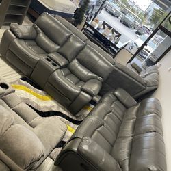 Fourth of July sale. Madrid, gray leather reclining sofa and loveseat set now $1199. Easy finance option. Same-day delivery.