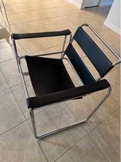 Modern leather chair, chrome, and black leather, like new