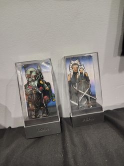 Star Wars figpins of Boba Fett and Ahsoka Tano.