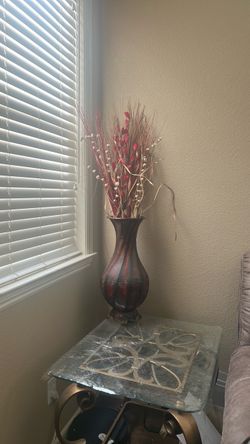 Metal Vase with dry flowers.