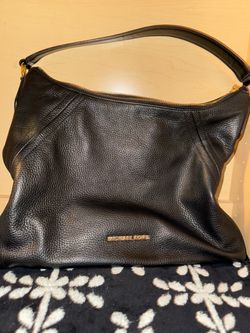 Mkors shoulder leather bag.