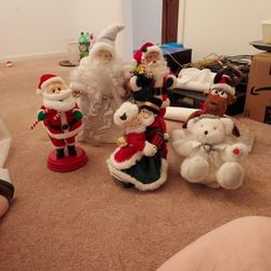 8 DIFFERENT  SANTA CLAUSES THAT PLAY  SONGS 8 FOR  $40.00 All  IN GOOD CONDITION