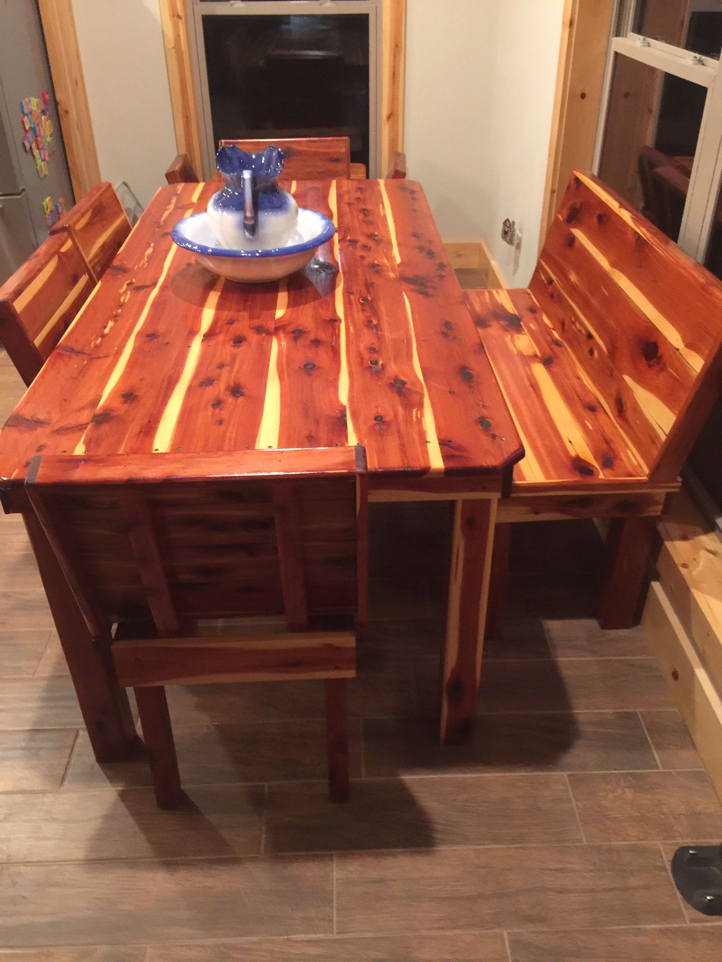 Cedar table with 4 chairs and a bench seat 250.00