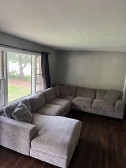 Sectional couch with pop up sleeper and storage chaise