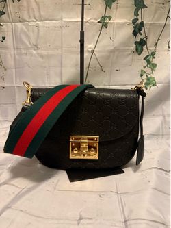 Crossbody with guitar strap with box and dust bag