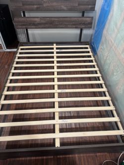 Queen size bed with lifted bud frame