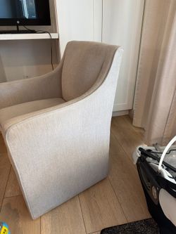 Upholstered office chair with wheels