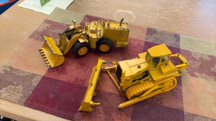 Vtg Germany cat solid metal tractors 2ea