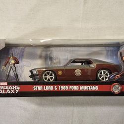 JADA METAL DIECAST 1:32 SCALE.  MARVEL GUARDIANS OF THE GALAXY  STAR LORD.  1969 FORD MUSTANG  WITH METAL DIECAST STAR  LORD FIGURE. 