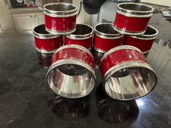 Set of 8 silver-plated red enamel napkin rings.