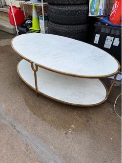 Oval coffee take with heavy marble tops