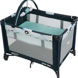 New In Box Graco Pack N Play Stratus With Bassinet, Toy Arch