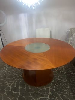 Round wood dining table with removable glass center