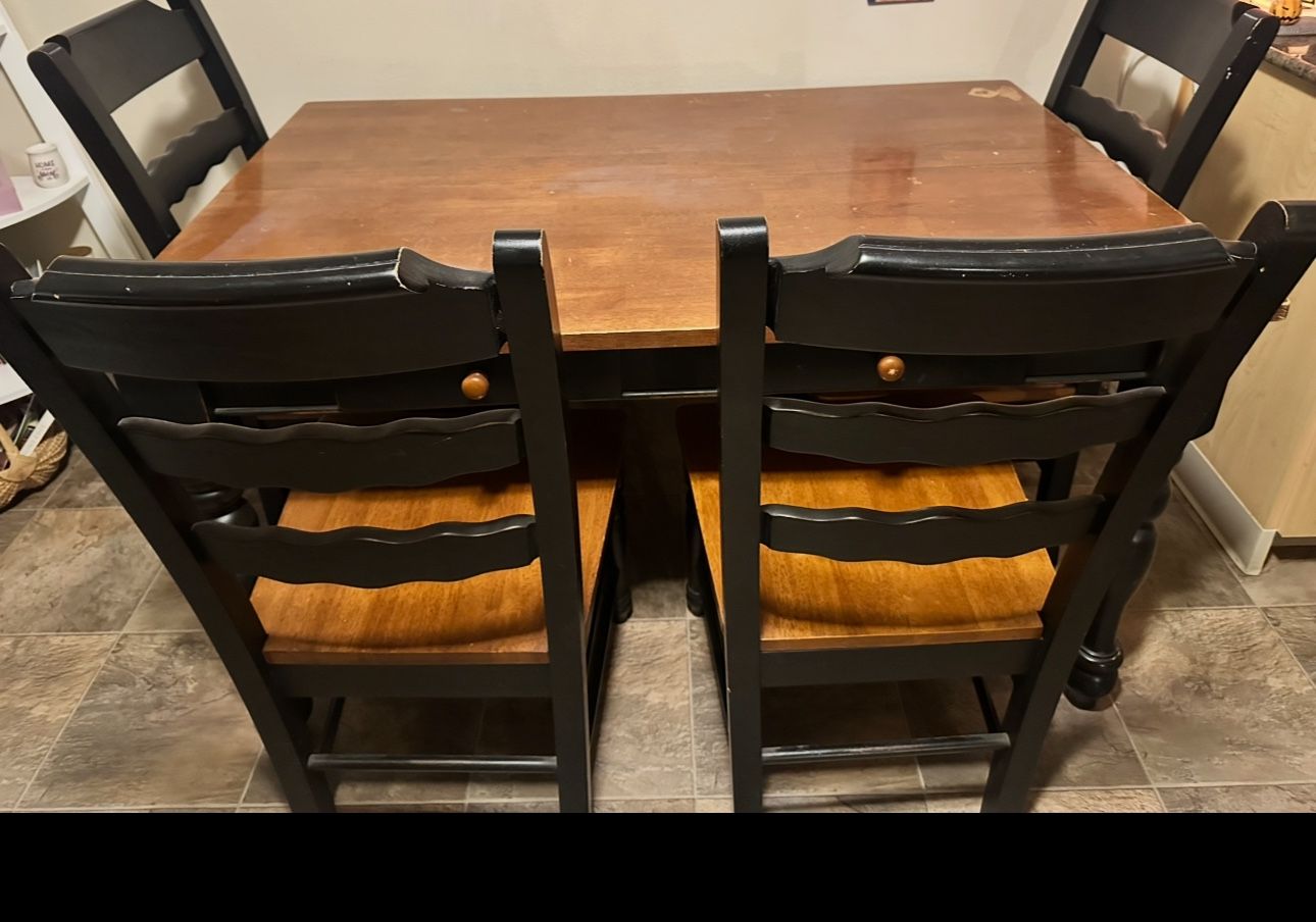 Wood dining table and 4 chairs.