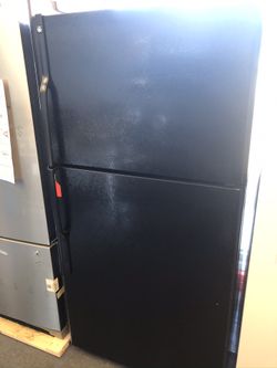 Used GE 18 cu ft top and bottom fridge. 1 year warranty